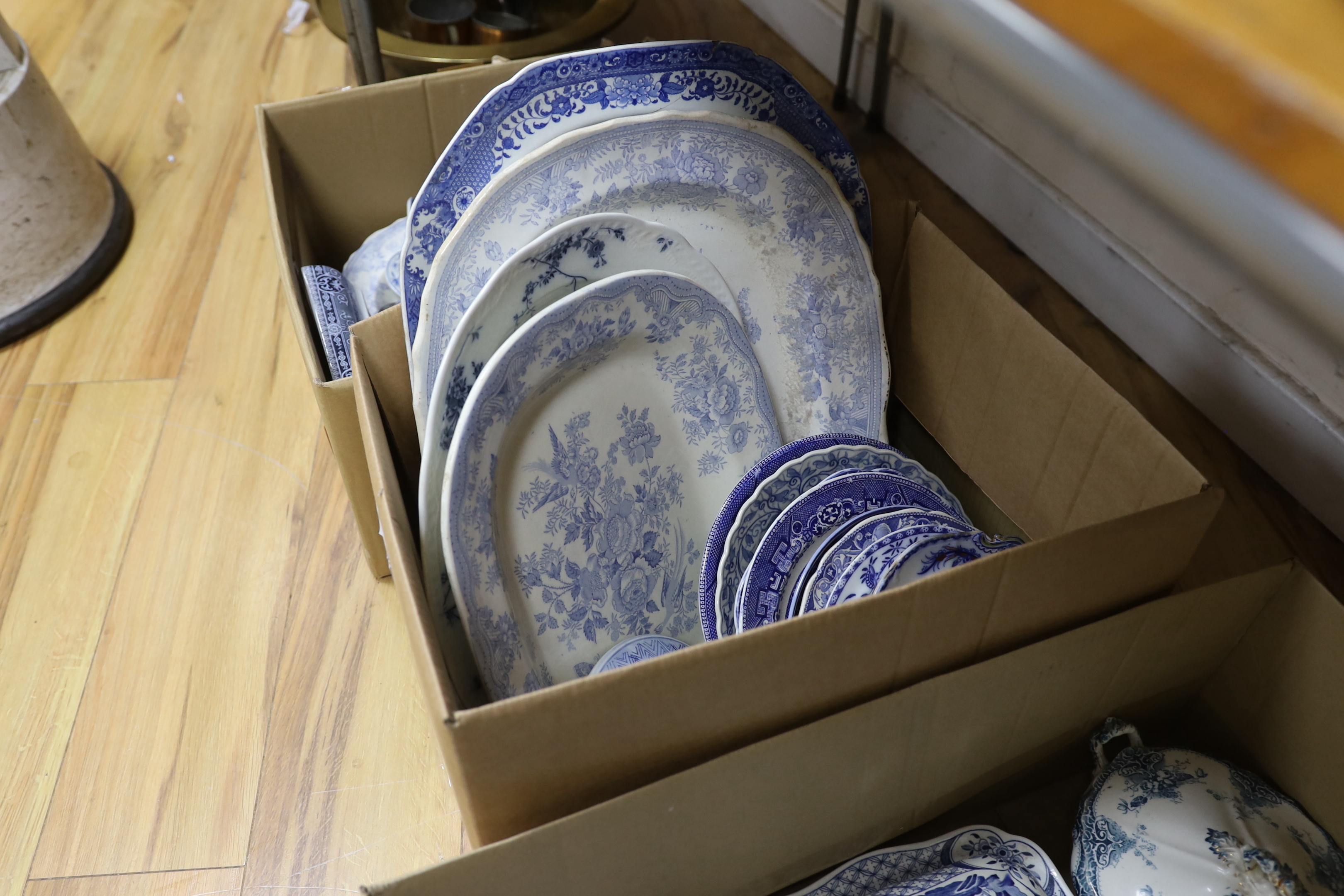 A collection of 19th / 20th century blue and white pottery including platters, tureens and jugs